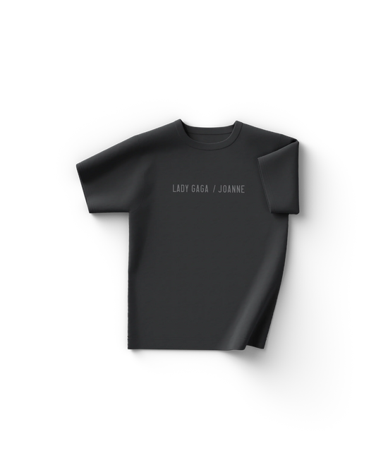 Black Lady Gaga Chromatica Ball T-shirt with surreal clawed hand graphic surrounded by glowing light