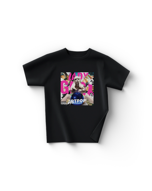 Black Lady Gaga t-shirt displaying the full-color ARTPOP album cover, featuring a marble statue of Gaga holding a reflective blue sphere, with bold pink “LADY GAGA” text and the word “ARTPOP” across the bottom. An iconic piece of pop culture and Gaga’s most artistic era.

