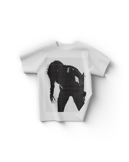 White Lady Gaga t-shirt with a black grunge-style silhouette of Gaga bent forward in a distressed, punk-zine aesthetic. The high-contrast front design gives off raw energy, echoing the avant-garde vibe of the Chromatica era.

